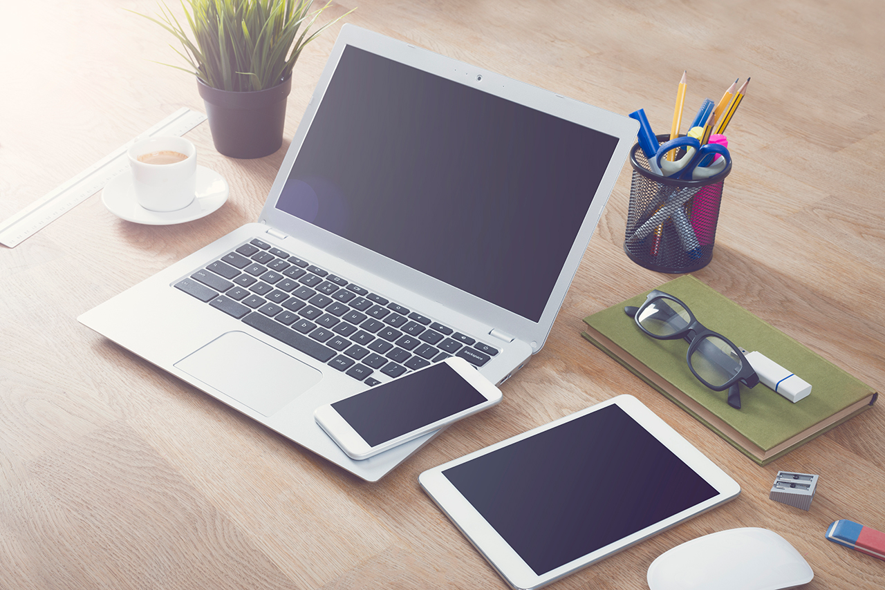phone laptop on desk